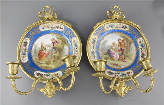 A pair of Sevres style porcelain plates, height 15in. diameter 10in.